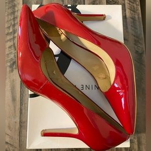 Nine West red patent pumps